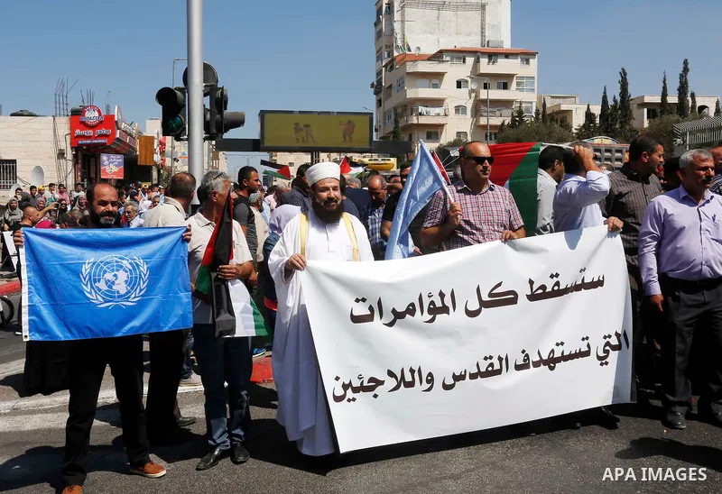 Palestinians take part during a protest against the United States decision earlier this year to stop funding and backing the United Nations Relief and Works Agency (UNRWA), in conjunction of the General Debate of the 73r...