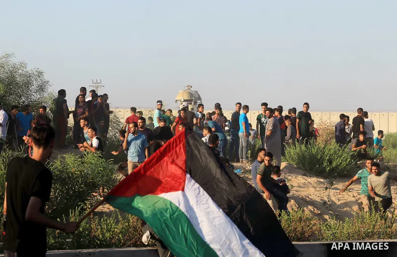 Palestinian protesters gather during clashes with Israeli forces in a demonstration against Israeli blockade on Gaza Strip, at the Erez crossing with Israel in the northern Gaza Strip, on September 26, 2018. Photo by Mah...