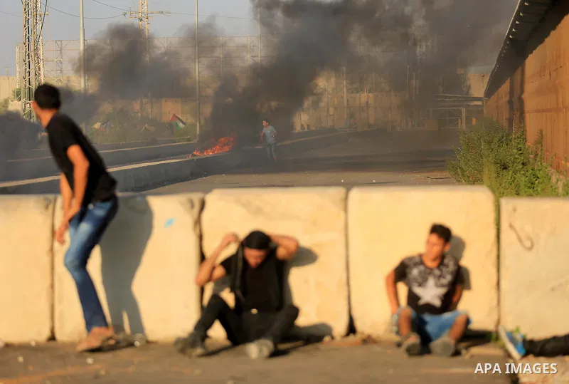 Palestinian protesters gather during clashes with Israeli forces in a demonstration against Israeli blockade on Gaza Strip, at the Erez crossing with Israel in the northern Gaza Strip, on September 26, 2018. Photo by Daw...