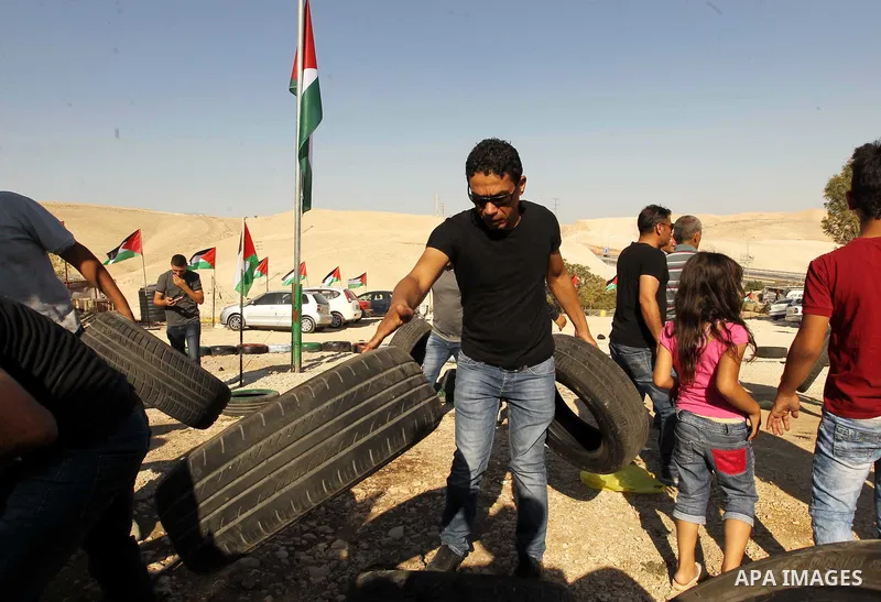 Palestinian protesters and Activists gather at the Bedouin village of Khan al-Ahmar, in the occupied West Bank against Israel's plan to demolish the village on September 27, 2018. Photo by Wisam Hashlamoun
