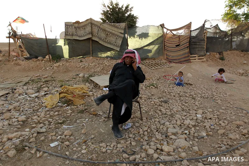 Palestinian protesters and Activists gather at the Bedouin village of Khan al-Ahmar, in the occupied West Bank against Israel's plan to demolish the village on September 27, 2018. Photo by Wisam Hashlamoun