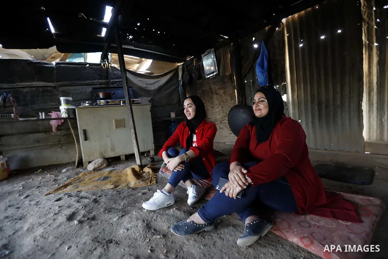 Palestinian protesters and Activists gather at the Bedouin village of Khan al-Ahmar, in the occupied West Bank against Israel's plan to demolish the village on September 27, 2018. Photo by Wisam Hashlamoun