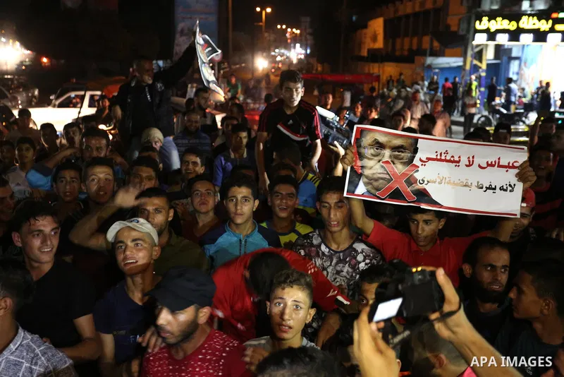 Palestinians take part in a protest against president Mahmoud Abbas following his speech at the United Nations General Assembly, in Rafah in the southern Gaza Strip September 27,2018. Photo by Ashraf Amra