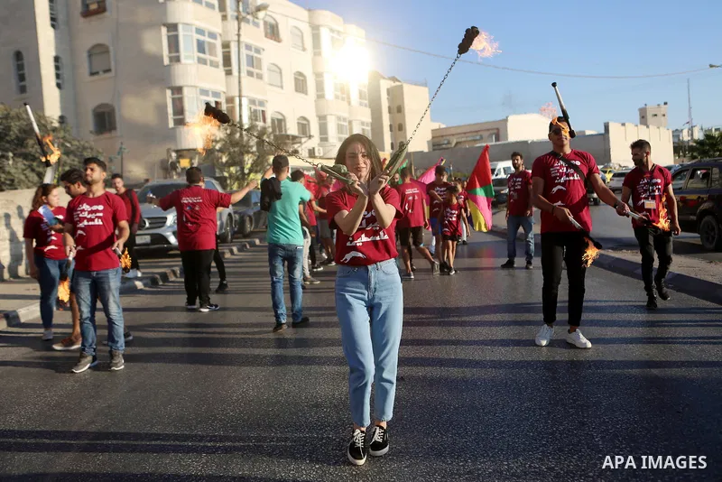 Palestinian participants perform at street during Palestine circus festival 2018, in the West Bank city of Ramallah on September 27, 2018. Photo by Shadi Hatem