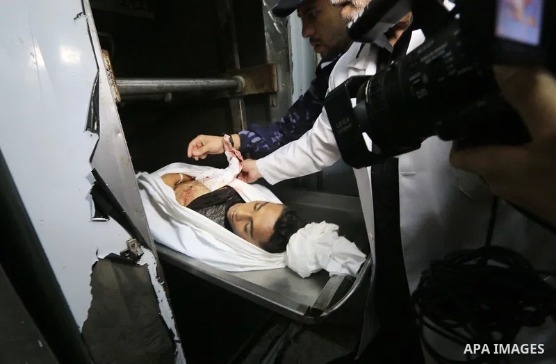 The body of Palestinian Teenager Mohammed Al-Houm, 14, who was shot dead by Israeli forces during clashes in tents protest where Palestinians demand the right to return to their homeland at the Israel-Gaza border, is see...