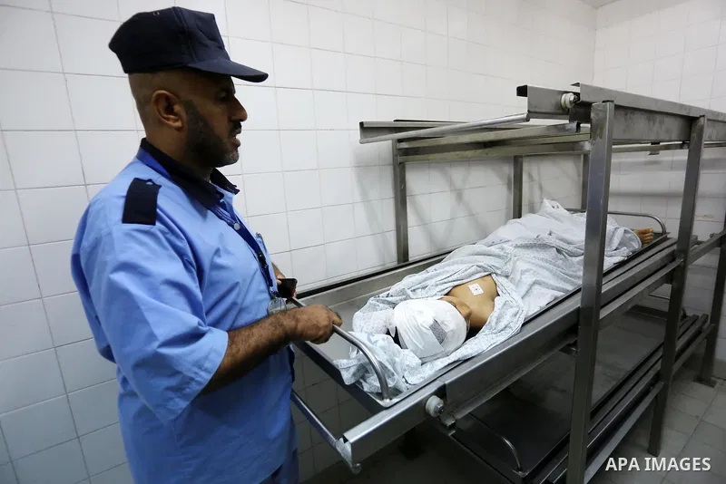 Palestinians gather around the body of Palestinian boy Nasser Musabah, 12, who was shot dead by Israeli forces during clashes in tents protest where Palestinians demand the right to return to their homeland at the Israel...