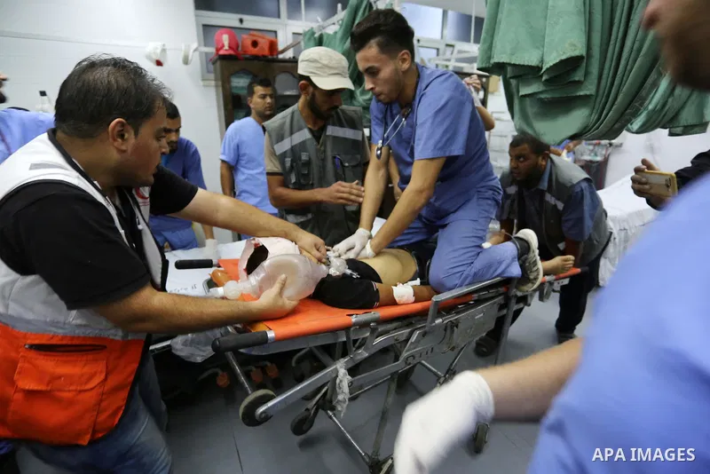 Paramedics carry the body of Palestinian boy Nasser Musabah, 12, who was shot dead by Israeli forces during clashes in tents protest where Palestinians demand the right to return to their homeland at the Israel-Gaza bord...