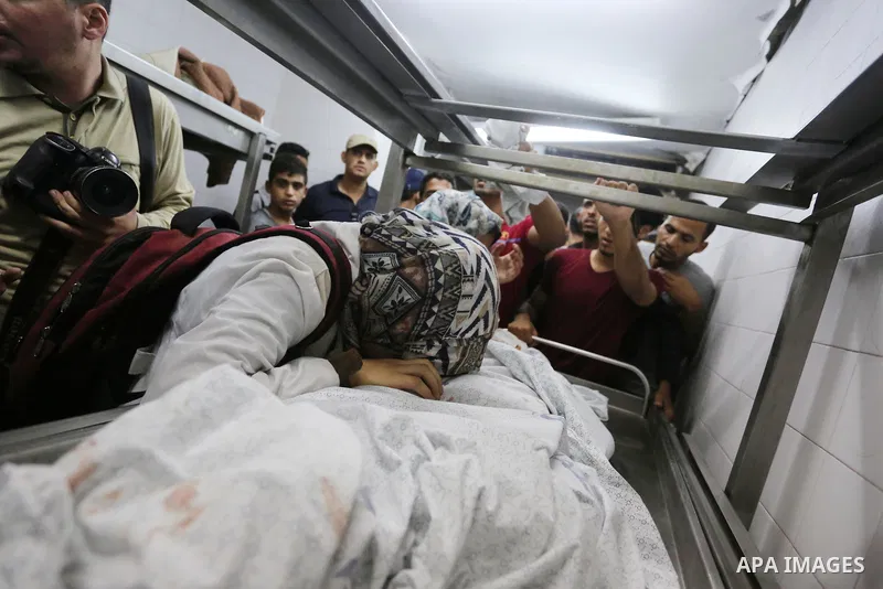 Relatives of Palestinian boy Nasser Musabah, 12, who was shot dead by Israeli forces during clashes in tents protest where Palestinians demand the right to return to their homeland at the Israel-Gaza border, mourn over h...