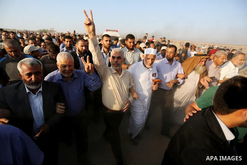 Hamas's leader in the Gaza Strip Yahya Sinwar participates during tents protest where Palestinians demand the right to return to their homeland at the Israel-Gaza border, in Khan Younis in the southern of Gaza Strip on S...