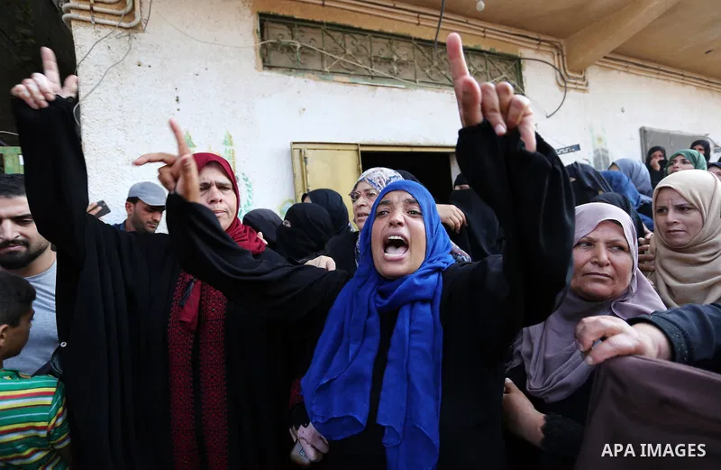 Relatives of Palestinian boy Nasser Mosabih, 12, who was shot dead by Israeli forces during clashes in tents protest where Palestinians demand the right to return to their homeland at the Israel-Gaza border, mourn during...