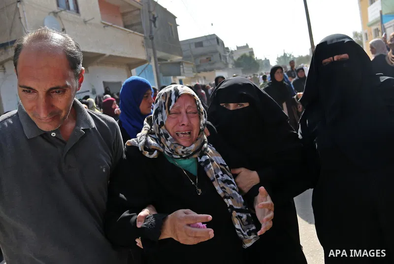 Relatives of Palestinian boy Nasser Mosabih, 12, who was shot dead by Israeli forces during clashes in tents protest where Palestinians demand the right to return to their homeland at the Israel-Gaza border, mourn during...