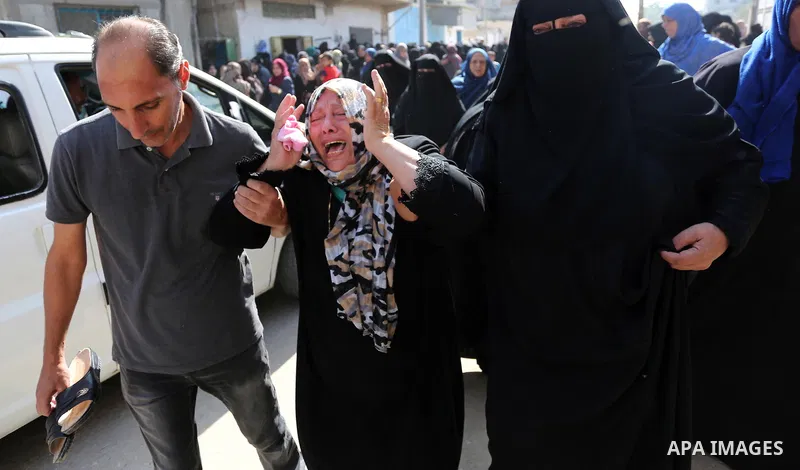 Relatives of Palestinian boy Nasser Mosabih, 12, who was shot dead by Israeli forces during clashes in tents protest where Palestinians demand the right to return to their homeland at the Israel-Gaza border, mourn during...
