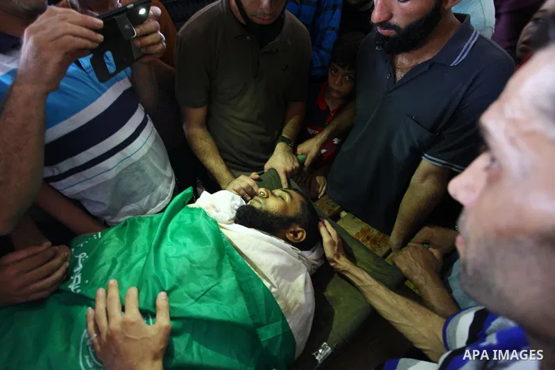 Relatives of Palestinian Mohammed Haniyeh who was shot dead by Israeli forces during clashes in tents protest where Palestinians demand the right to return to their homeland at the Israel-Gaza border, mourn over his body...