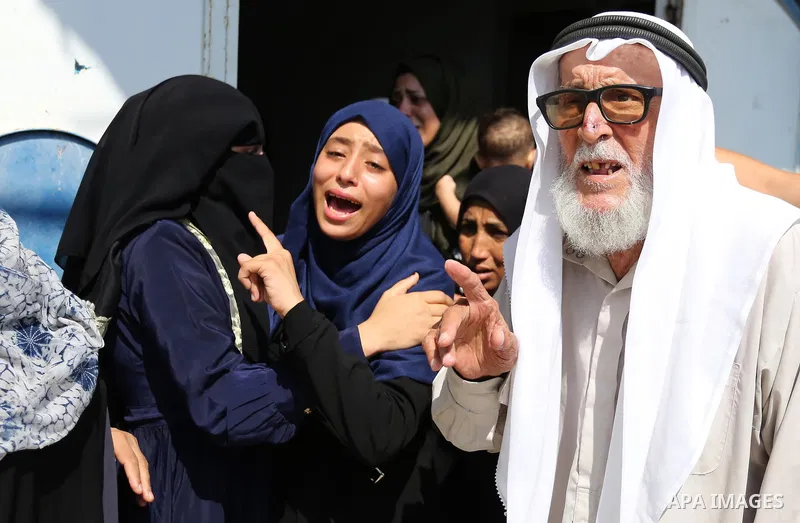 Relatives of Palestinian Mohammed Anshasi, 18, who was shot dead by Israeli forces during clashes in tents protest where Palestinians demand the right to return to their homeland at the Israel-Gaza border, mourn during h...