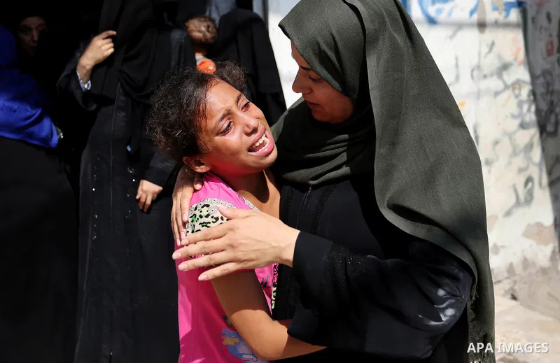 Relatives of Palestinian Mohammed Anshasi, 18, who was shot dead by Israeli forces during clashes in tents protest where Palestinians demand the right to return to their homeland at the Israel-Gaza border, mourn during h...