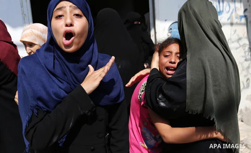 Relatives of Palestinian Mohammed Anshasi, 18, who was shot dead by Israeli forces during clashes in tents protest where Palestinians demand the right to return to their homeland at the Israel-Gaza border, mourn during h...