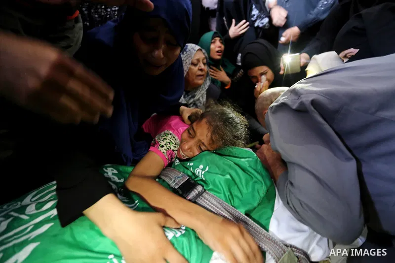 Relatives of Palestinian Mohammed Anshasi, 18, who was shot dead by Israeli forces during clashes in tents protest where Palestinians demand the right to return to their homeland at the Israel-Gaza border, mourn over his...