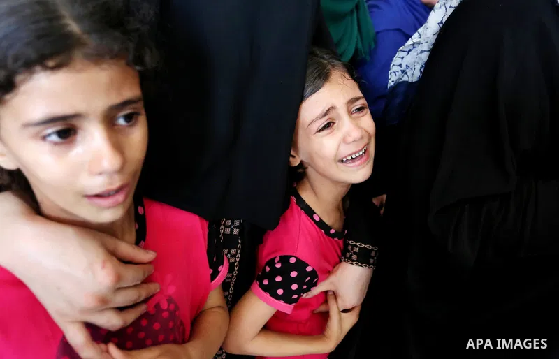 Relatives of Palestinian Mohammed Anshasi, 18, who was shot dead by Israeli forces during clashes in tents protest where Palestinians demand the right to return to their homeland at the Israel-Gaza border, mourn during h...
