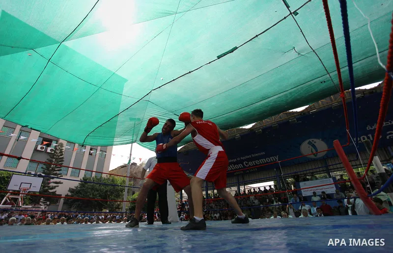Palestinian fighters compete during the first individual boxing tournament at the University College of Applied Sciences "UCAS" in Gaza city, on September 30, 2018. Photo by Mahmoud Ajjour