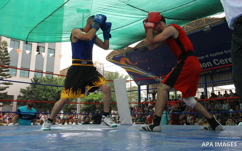 Palestinian fighters compete during the first individual boxing tournament at the University College of Applied Sciences "UCAS" in Gaza city, on September 30, 2018. Photo by Mahmoud Ajjour