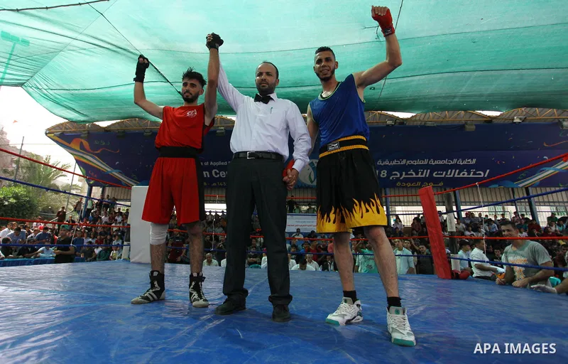 Palestinian fighters compete during the first individual boxing tournament at the University College of Applied Sciences "UCAS" in Gaza city, on September 30, 2018. Photo by Mahmoud Ajjour