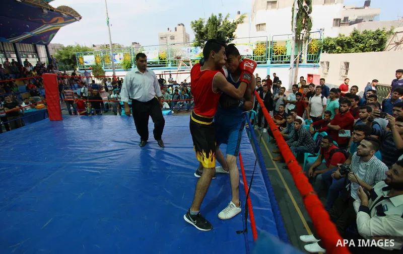 Palestinian fighters compete during the first individual boxing tournament at the University College of Applied Sciences "UCAS" in Gaza city, on September 30, 2018. Photo by Mahmoud Ajjour
