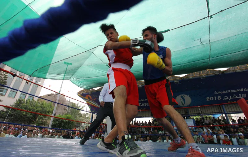 Palestinian fighters compete during the first individual boxing tournament at the University College of Applied Sciences "UCAS" in Gaza city, on September 30, 2018. Photo by Mahmoud Ajjour