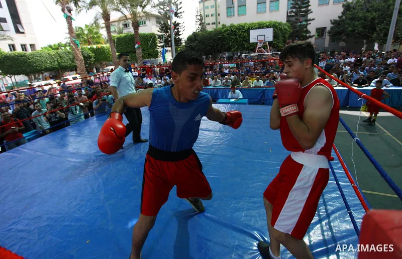 Palestinian fighters compete during the first individual boxing tournament at the University College of Applied Sciences "UCAS" in Gaza city, on September 30, 2018. Photo by Mahmoud Ajjour
