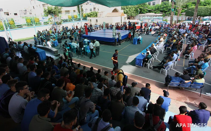 Palestinian fighters compete during the first individual boxing tournament at the University College of Applied Sciences "UCAS" in Gaza city, on September 30, 2018. Photo by Mahmoud Ajjour