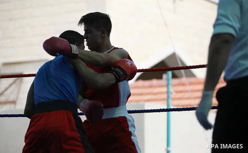 Palestinian fighters compete during the first individual boxing tournament at the University College of Applied Sciences "UCAS" in Gaza city, on September 30, 2018. Photo by Mahmoud Ajjour
