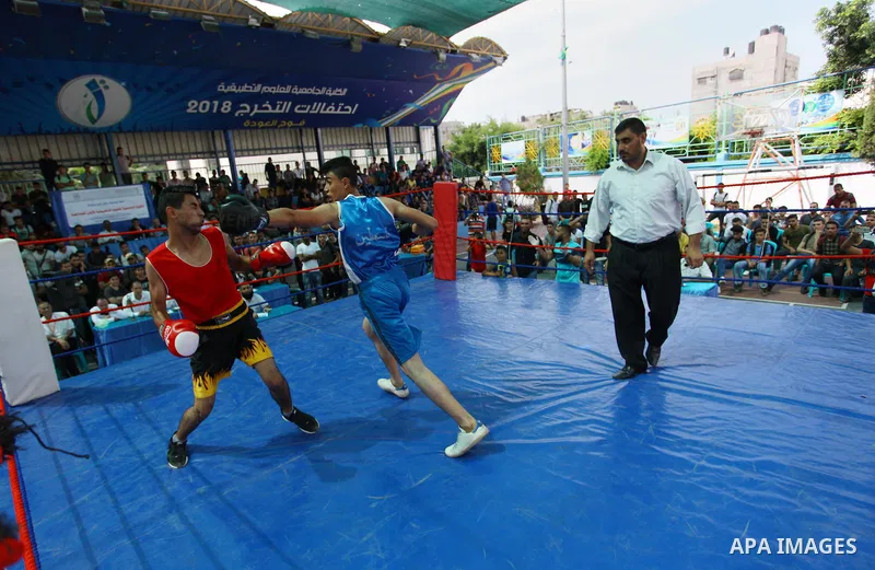 Palestinian fighters compete during the first individual boxing tournament at the University College of Applied Sciences "UCAS" in Gaza city, on September 30, 2018. Photo by Mahmoud Ajjour