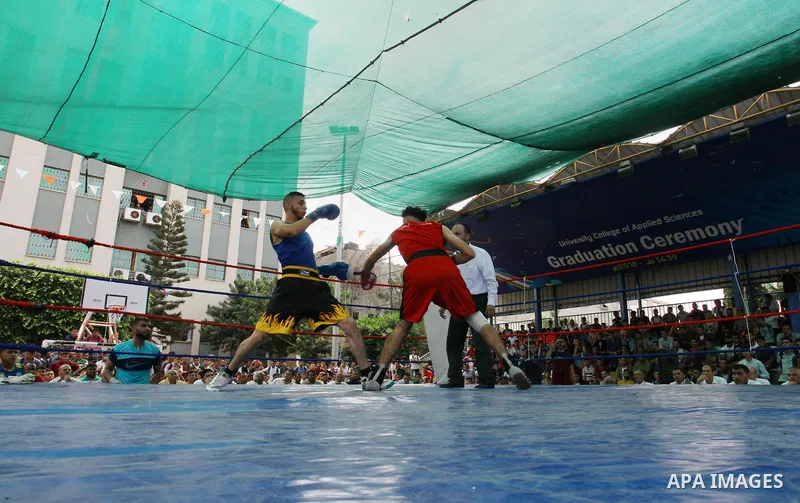 Palestinian fighters compete during the first individual boxing tournament at the University College of Applied Sciences "UCAS" in Gaza city, on September 30, 2018. Photo by Mahmoud Ajjour