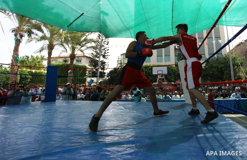 Palestinian fighters compete during the first individual boxing tournament at the University College of Applied Sciences "UCAS" in Gaza city, on September 30, 2018. Photo by Mahmoud Ajjour