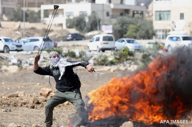 Palestinian protesters clash with Israeli forces in a demonstration against Israel's controversial Jewish nation-state law and Israel's plan to demolish the Palestinian Bedouin village of Khan al-Ahmar, near the Jewish s...