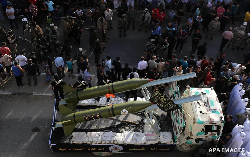 Palestinian members of the Al-Quds Brigades, the military wing of the Islamic Jihad group, march with their weapons to show loyalty for the Iranian-backed Palestinian movement's newly elected leader Ziad al-Nakhalah duri...