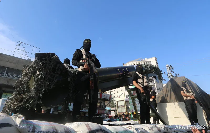 Palestinian members of the Al-Quds Brigades, the military wing of the Islamic Jihad group, take part with their weapons to show loyalty for the Palestinian movement's newly elected leader Ziad al-Nakhalah during a rally...