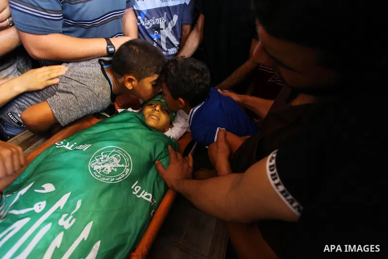 Relatives of Palestinian boy Faris al-Sersawi, 12, who was shot dead by Israeli froces during clashes in tents protest where Palestinians demand the right to return to their homeland at the Israel-Gaza border, mourn over...