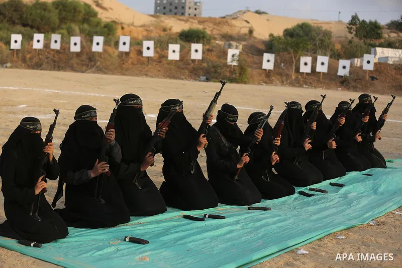 Palestinian Female members of al-Quds brigades, the military wing of Jihad Islamic organisation, Show their combat skills during a military show in Khan Yunis at southern Gaza Strip, on Oct. 6, 2018. Photo by Ashraf Amra