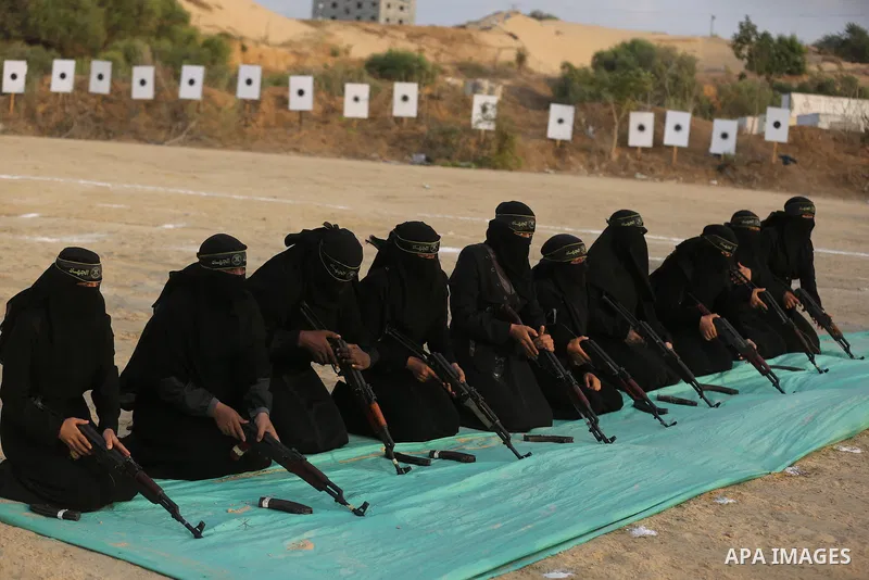 Palestinian Female members of al-Quds brigades, the military wing of Jihad Islamic organisation, Show their combat skills during a military show in Khan Yunis at southern Gaza Strip, on Oct. 6, 2018. Photo by Ashraf Amra