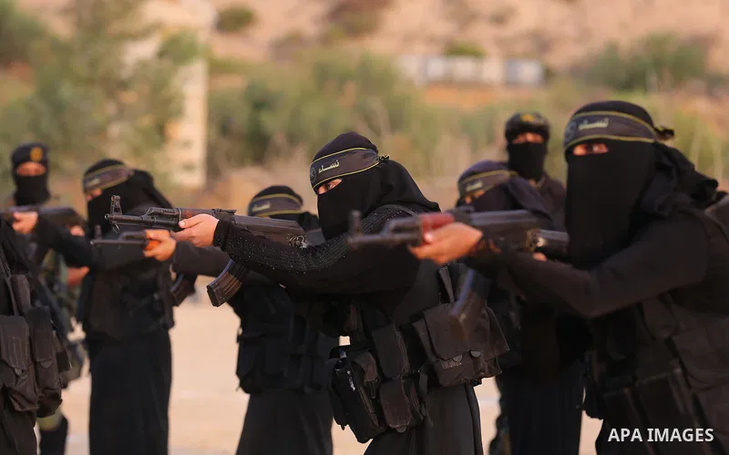 Palestinian Female members of al-Quds brigades, the military wing of Jihad Islamic organisation, Show their combat skills during a military show in Khan Yunis at southern Gaza Strip, on Oct. 6, 2018. Photo by Ashraf Amra