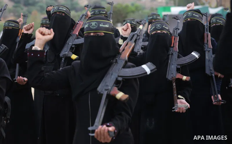 Palestinian Female members of al-Quds brigades, the military wing of Jihad Islamic organisation, Show their combat skills during a military show in Khan Yunis at southern Gaza Strip, on Oct. 6, 2018. Photo by Ashraf Amra