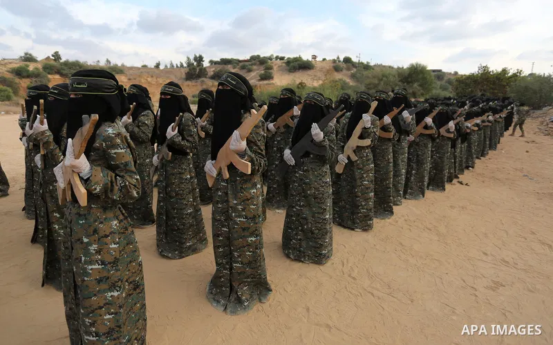 Palestinian Female members of al-Quds brigades, the military wing of Jihad Islamic organisation, Show their combat skills during a military show in Khan Yunis at southern Gaza Strip, on Oct. 6, 2018. Photo by Ashraf Amra