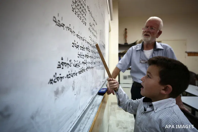 Samaritan tutor Ragheb Mfarrej ,78, teaches kids the ancient Samaritan language, at Mount Gerizim near the West Bank city of Nablus, on October 7, 2018. The kids start learning Hebrew ancient language on their 6 years ol...