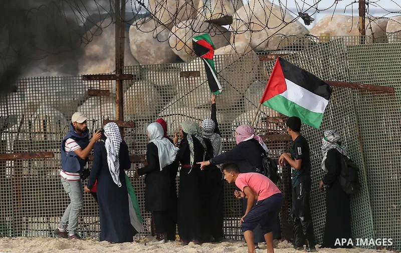 Palestinian protesters gather during clashes with Israeli forces in a demonstration against the Israeli blockade on Gaza Strip, along the Gaza sea barrier on the maritime border with Israel near Kibbutz Zikim, north of B...