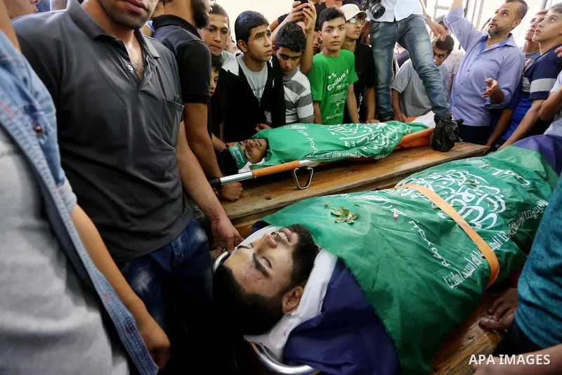 Relatives of Palestinians Ahmed al-Tawil, 27, and Ahmed Abu Naim, 17, who were shot dead by Israeli troops during clashes in tents protest where Palestinian demand rights to return to their homeland at Israel-Gaza border...