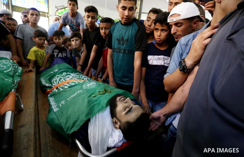 Relatives of Palestinians Ahmed al-Tawil, 27, and Ahmed Abu Naim, 17, who were shot dead by Israeli troops during clashes in tents protest where Palestinian demand rights to return to their homeland at Israel-Gaza border...