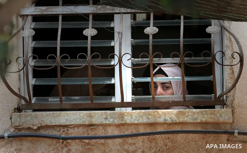Palestinian relatives of Aisha al-Rabi, 48, weep during her funeral in the West Bank village of Becya, near The West Bank City of Salfit, 13 October 2018. According to media reports, al-Rabi was killed while her husband...