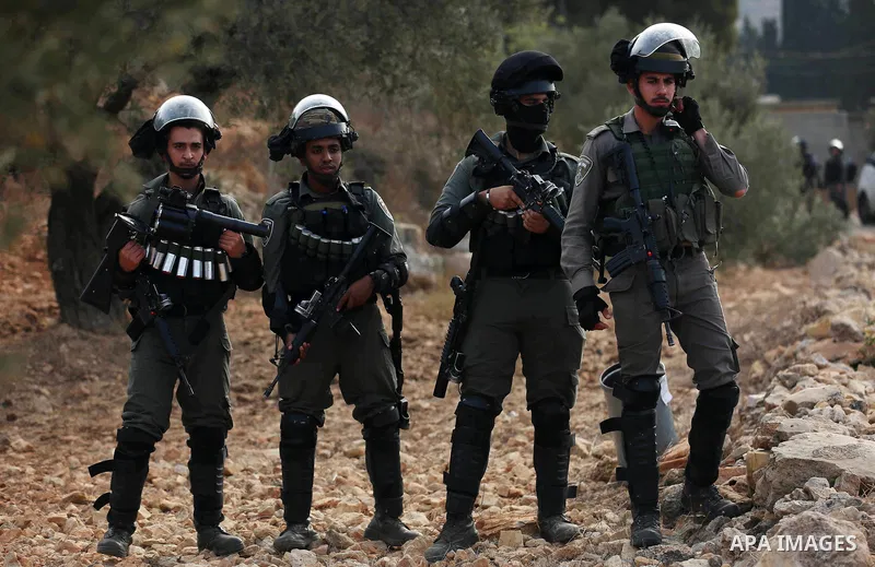 Israeli soldiers take position during clashes with Palestinian order to shut down a Palestinian school in the West Bank city of Nablus, on October 15, 2018. Photo by Shadi Jarar'ah