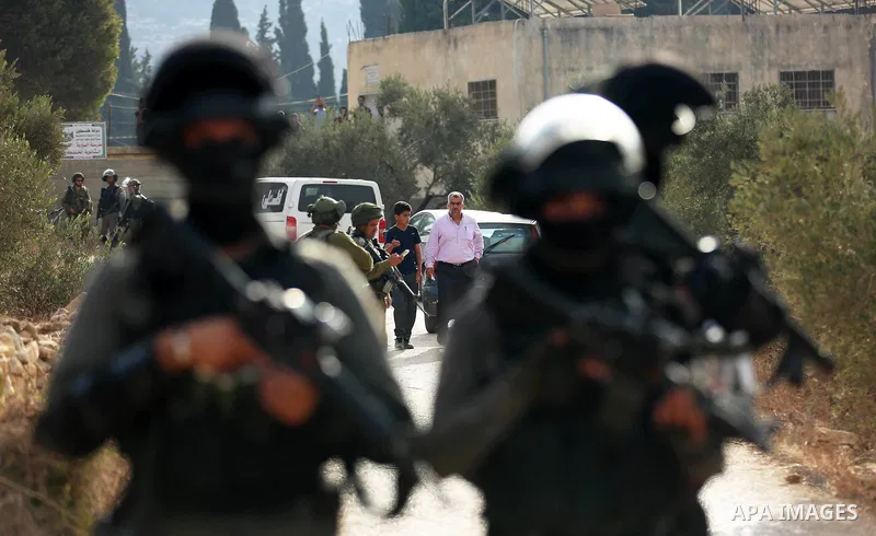 Israeli soldiers take position during clashes with Palestinian order to shut down a Palestinian school in the West Bank city of Nablus, on October 15, 2018. Photo by Shadi Jarar'ah