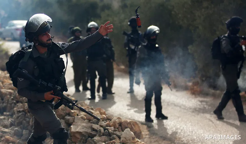 Israeli soldiers take position during clashes with Palestinian order to shut down a Palestinian school in the West Bank city of Nablus, on October 15, 2018. Photo by Shadi Jarar'ah